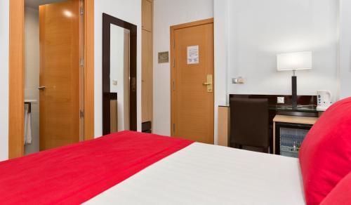 Postel nebo postele na pokoji v ubytování Hotel Baviera