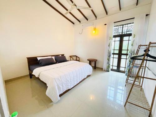 a bedroom with a bed and a ladder in it at House with Private Pool Perfect for Family Holiday in Mount Lavinia