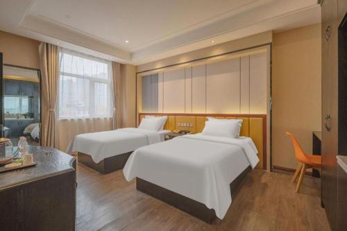 Postel nebo postele na pokoji v ubytování PAI Hotels Shijiazhuang Zhengding Gucheng