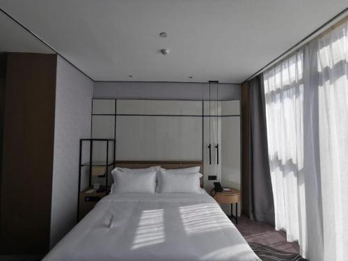 Cama o camas de una habitación en Shenzhen Apex Hotel (Technology Park Branch)
