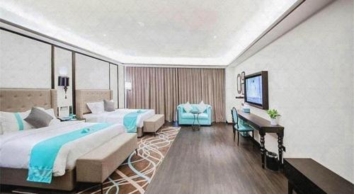 a hotel room with two beds and a desk at Xana Hotelle Jinan Wuanfu Interchange Huafu International Square in Jinan