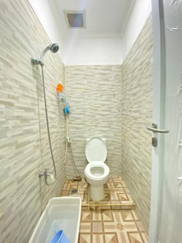 a bathroom with a shower and a toilet and a sink at Private Room in Villa Near Nusa Dua Beach Bali in Nusa Dua