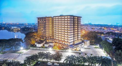 an overhead view of a tall building in a city at Axia South Cikarang Service Apartment in Cikarang