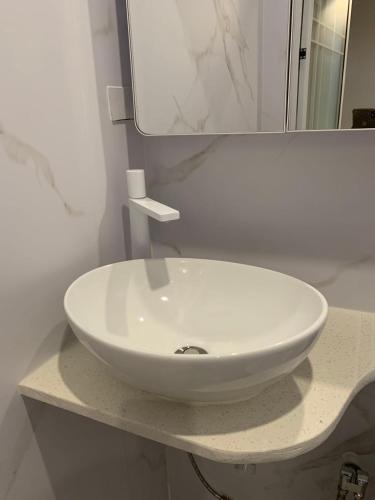 a white sink on a counter in a bathroom at Ashely apartment 2 bedrrooms in Nadi