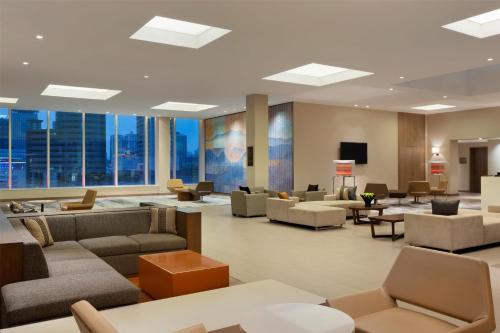 a waiting room at a hospital with couches and chairs at Hyatt Place Shenzhen Dongmen in Shenzhen