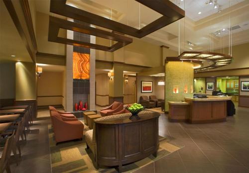 a lobby of a hotel with chairs and a table at Hyatt Place Shenzhen Dongmen in Shenzhen