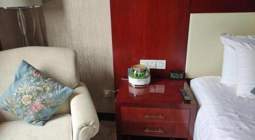Katil atau katil-katil dalam bilik di New Century Hotel Zaozhuang Fengming