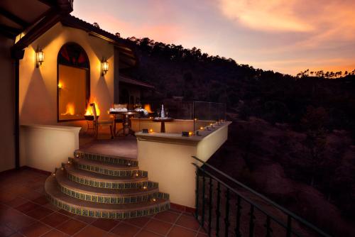 a set of stairs leading up to a building with a restaurant at The Orchard at Peora Estates in Mukteswar