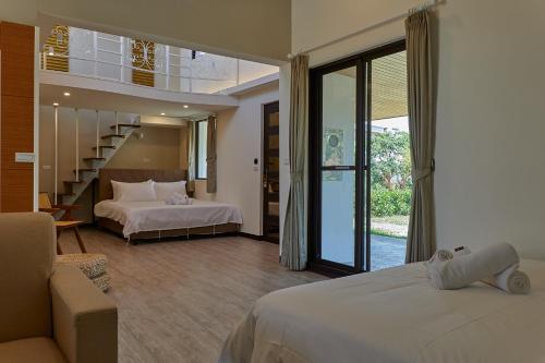 Ένα ή περισσότερα κρεβάτια σε δωμάτιο στο Cliff Villa
