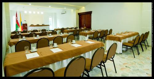 a conference room with tables and chairs in it at Hotel Buena Vista in Bucaramanga