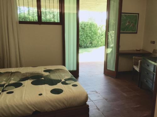 Postel nebo postele na pokoji v ubytování Villa Sibel con piscina in Versilia