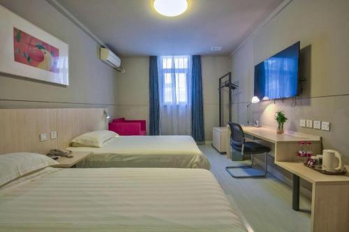 Cama o camas de una habitación en Jinjiang Inn Taizhou Huangyan Jiufeng Park