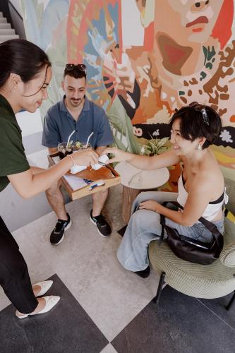 a group of people sitting around a table at Jiva Flow Kerobokan in Kerobokan