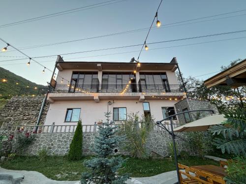 a house with lights on top of it at TIGRAN Hotel by Black & Gold in Goris