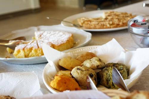 a table with plates of food on top of it at Masseria Carignani in Tuglie