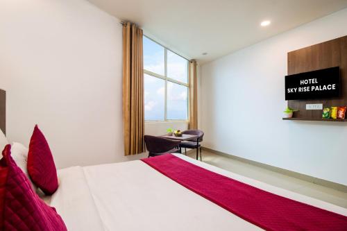 a hotel room with a bed and a window at HOTEL S R Palace - Free Airport Drop for Minimum 05 Nights Stay - 5 mins from IGI & Domestic Airport Delhi in New Delhi