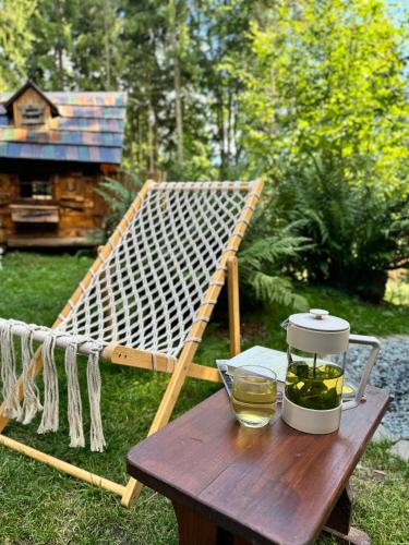 a wooden table with a blender on top of a table at Chalet Látky in Látky
