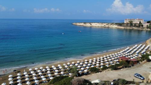 an aerial view of a beach with umbrellas at Villa Adela Coral-Bay 3B, Private Pool, Seaside in Peyia
