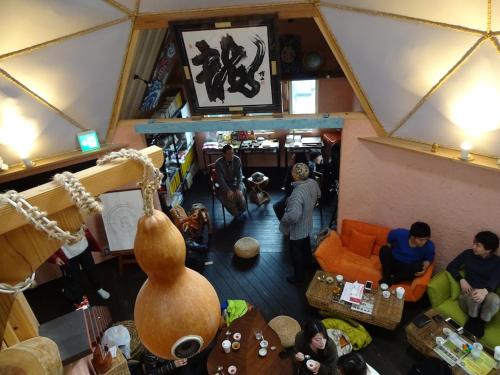 a group of people in a living room at Twin Dome Ryugu in Hokuto