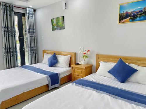 Postel nebo postele na pokoji v ubytování Ninh Giang Hotel & Apartment Vũng Tàu