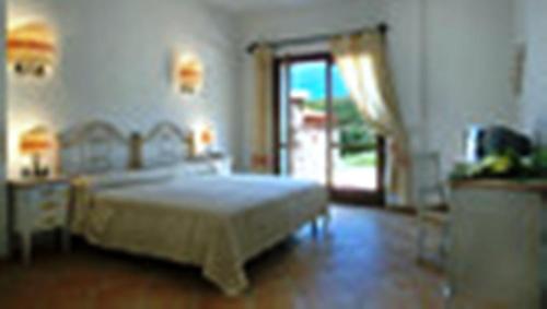 Un ou plusieurs lits dans un hébergement de l'établissement Hotel Valkarana Country Relais