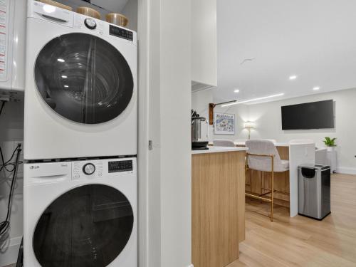 a white washer and dryer in a kitchen at 4BR 3Bath Game Room Harvard MIT Apt in Cambridge