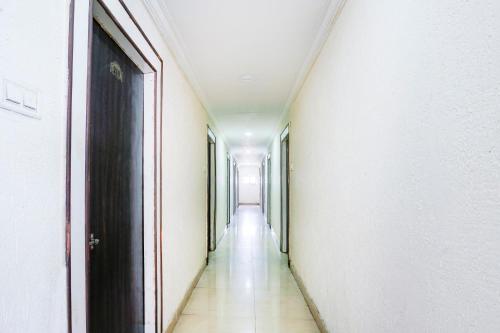 an empty corridor of a building with a door at SPOT ON Hotel Hyderabad Continental in Hyderabad