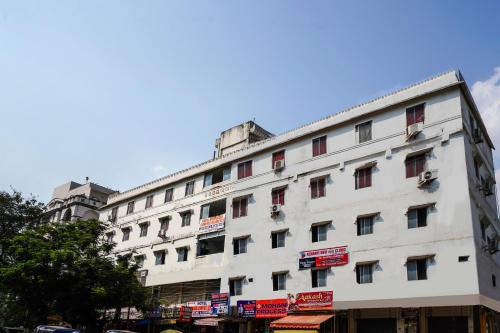 a large white building with signs on it at SPOT ON Hotel Hyderabad Continental in Hyderabad