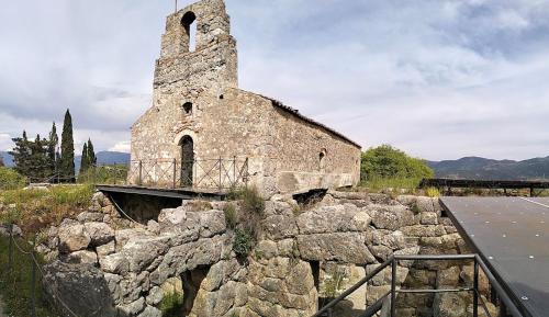 an old stone building on top of a stone wall at Hotel Alexandros in Ammoudia