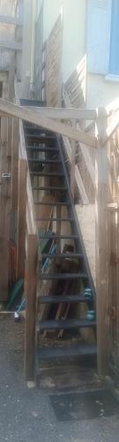 a set of stairs leading up to a building at La Salamandre, studio cosy au bord de l'eau in Bellerive-sur-Allier