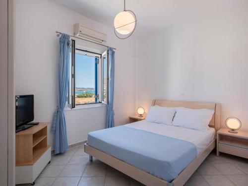 Ένα ή περισσότερα κρεβάτια σε δωμάτιο στο Emma's Summer House