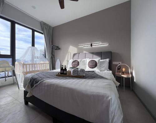 a bedroom with a large bed and a balcony at NEW UNIT# Georgetown #Tropicana #Luxury 2BR # 5pax in George Town