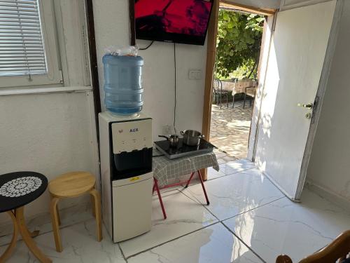 a water cooler with a bottle on top of it at Rooms Struga in Struga