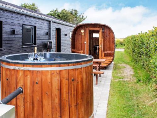 an outdoor hot tub in the backyard of a house at 10 person holiday home in Vinderup-By Traum in Vinderup