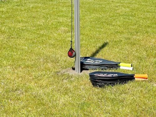 a group of baseball equipment sitting on the grass at 10 person holiday home in Vinderup-By Traum in Vinderup