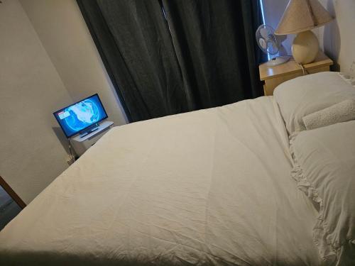 Postel nebo postele na pokoji v ubytování Rosy Guest House