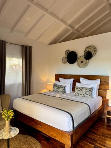 a bedroom with a large bed in a room at Andriana Resort & Spa in Nosy Be