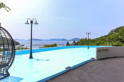 Der Swimmingpool an oder in der Nähe von Brown Dote Hotel Geunpohang