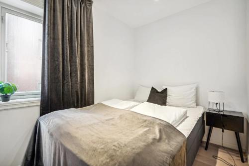 Ένα ή περισσότερα κρεβάτια σε δωμάτιο στο Beautiful city center apartment