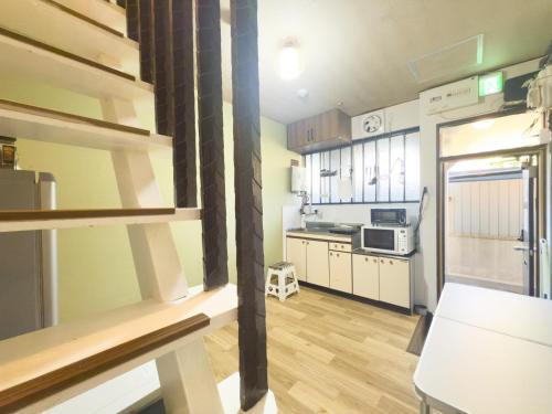a room with a kitchen with a counter top at Oyado Shogoin in Kyoto