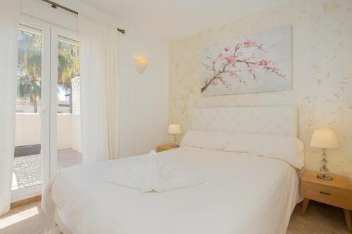 Ένα ή περισσότερα κρεβάτια σε δωμάτιο στο Luxury Penthouse Marbella Walk to Banus