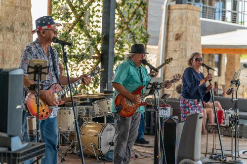 a group of people playing music on the street at Resort at Fredericksburg Unit 2 in Rocky Hill