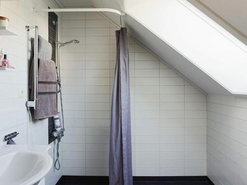 a bathroom with a shower and a sink at 9 person holiday home in SOLLENTUNA-By Traum in Sollentuna