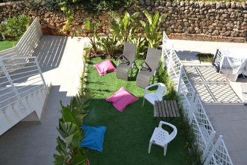 a group of chairs and tables on a lawn at Prima Fila in Calabernardo