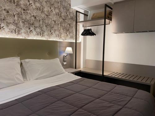 Viva Hotel Avellinoにあるベッド
