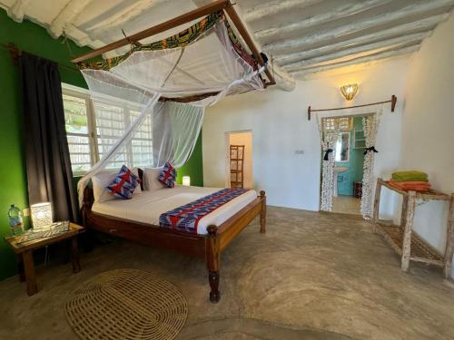 Кровать или кровати в номере Starfish Garden Lodge