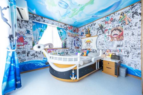 Postel nebo postele na pokoji v ubytování Live the Anime Dream! Unique Themed Guest House for Families & Groups in Tokyo