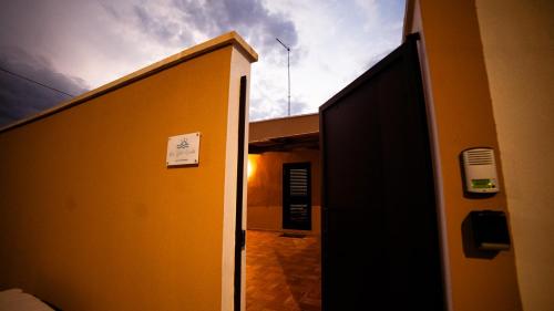 an open door to a hallway with a sky at Real Estate Salento in Campi Salentina