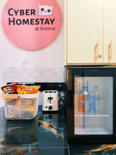 a kitchen with a counter top with a microwave at Cyberjaya HOMEstay With Playground Slide - 5 Pax in Gua Sai