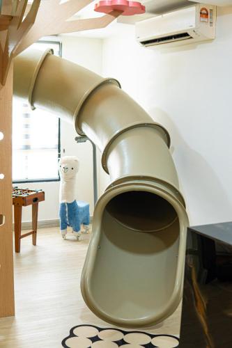 a close up of a toilet in a room at Cyberjaya HOMEstay With Playground Slide - 5 Pax in Gua Sai